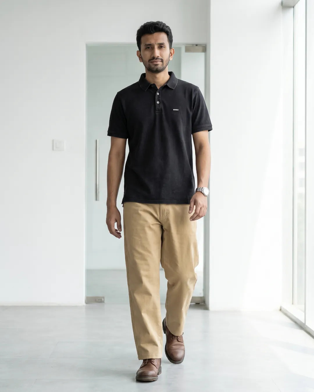 Heading out the door in a charcoal polo and chino