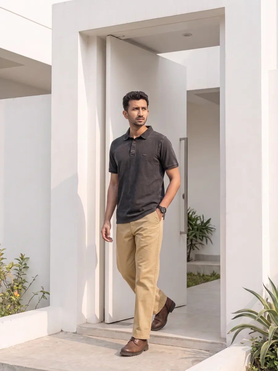 Stepping out the front door in a charcoal polo and khaki chino