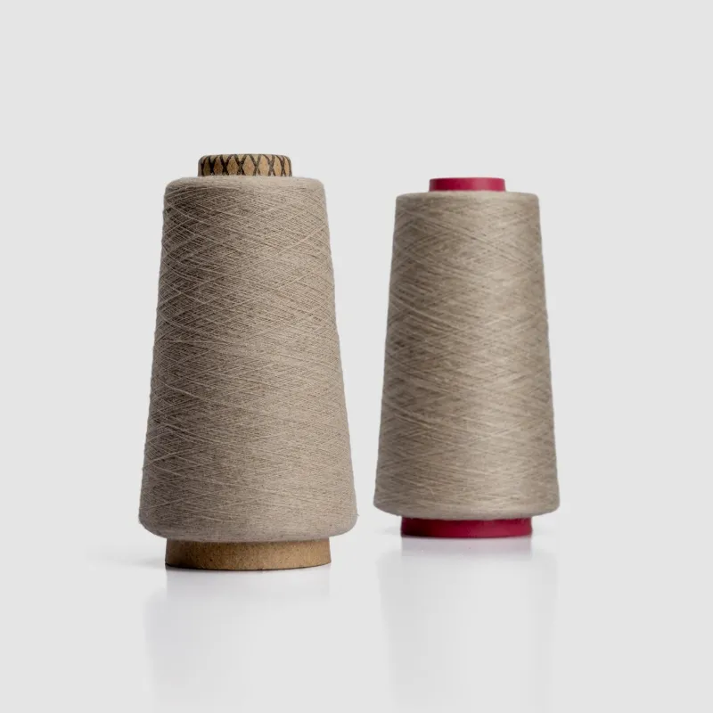 Two cones of natural-fibre yarn